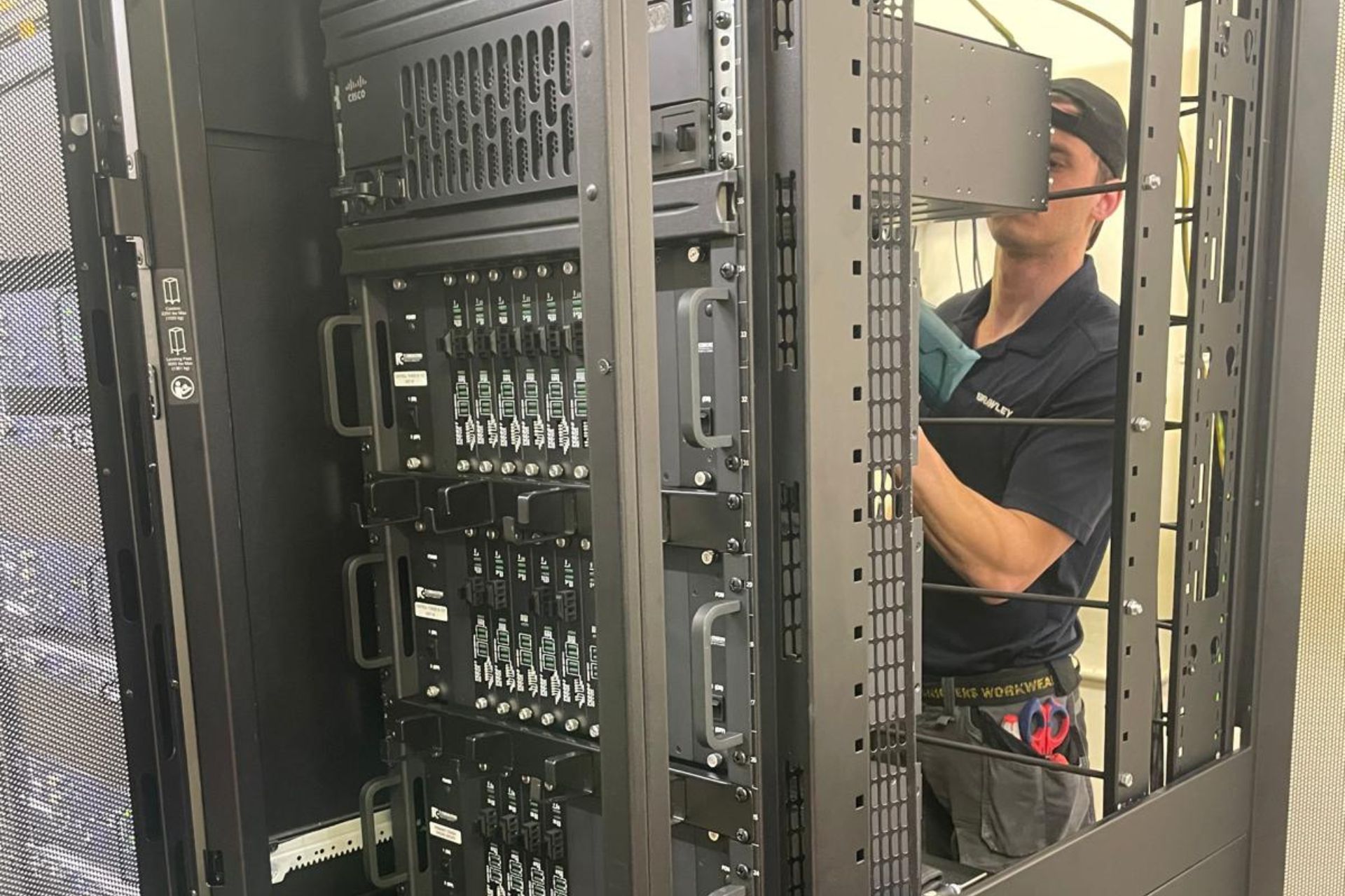 Birch Technical Services engineer working on structured cabling within a network rack